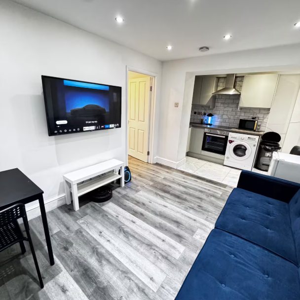 Whitehall Lane one-bedroom apartment photo 6: living room and kitchen area.