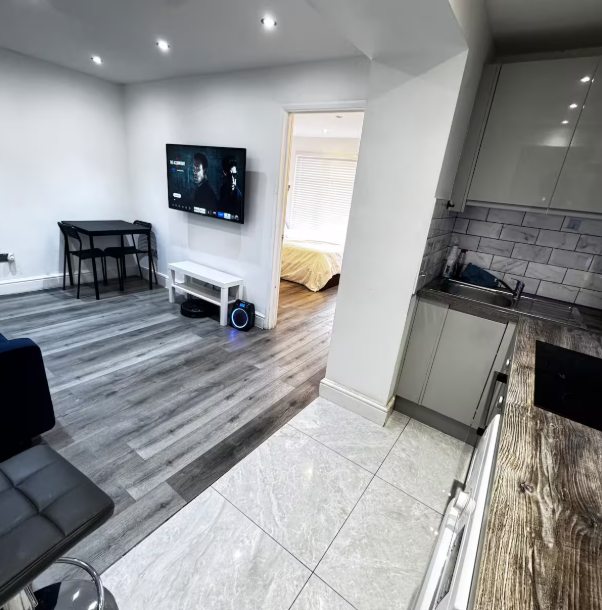 Whitehall Lane one-bedroom apartment photo 7: living room and kitchen area.